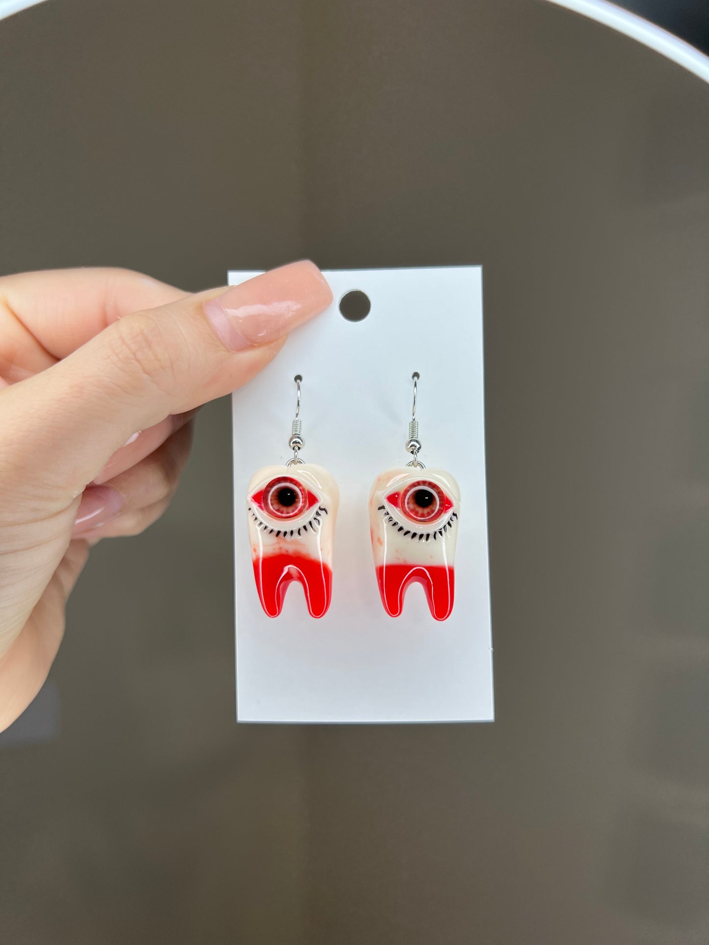 Tooth with eye earrings