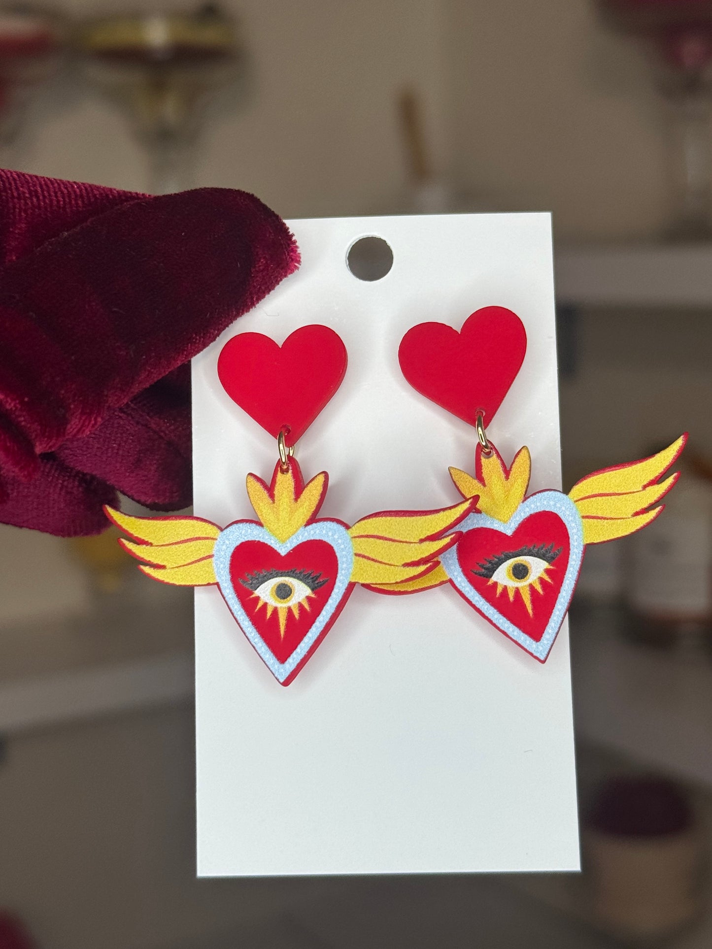 Red heart eye earrings
